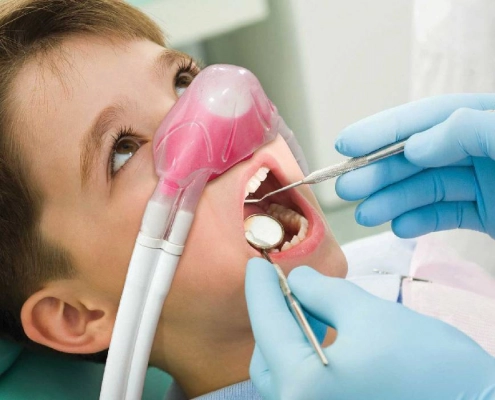 Child during laughing gas treatment at the dentist