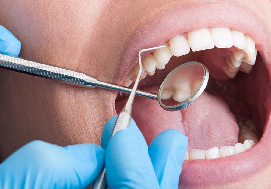 Examination of patient by dentist for root canal treatment